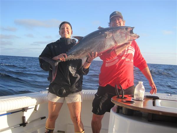 51e713a87246b-07-16-15 Jenna_and_Gary_with_her_42_lb_Blue_Fin